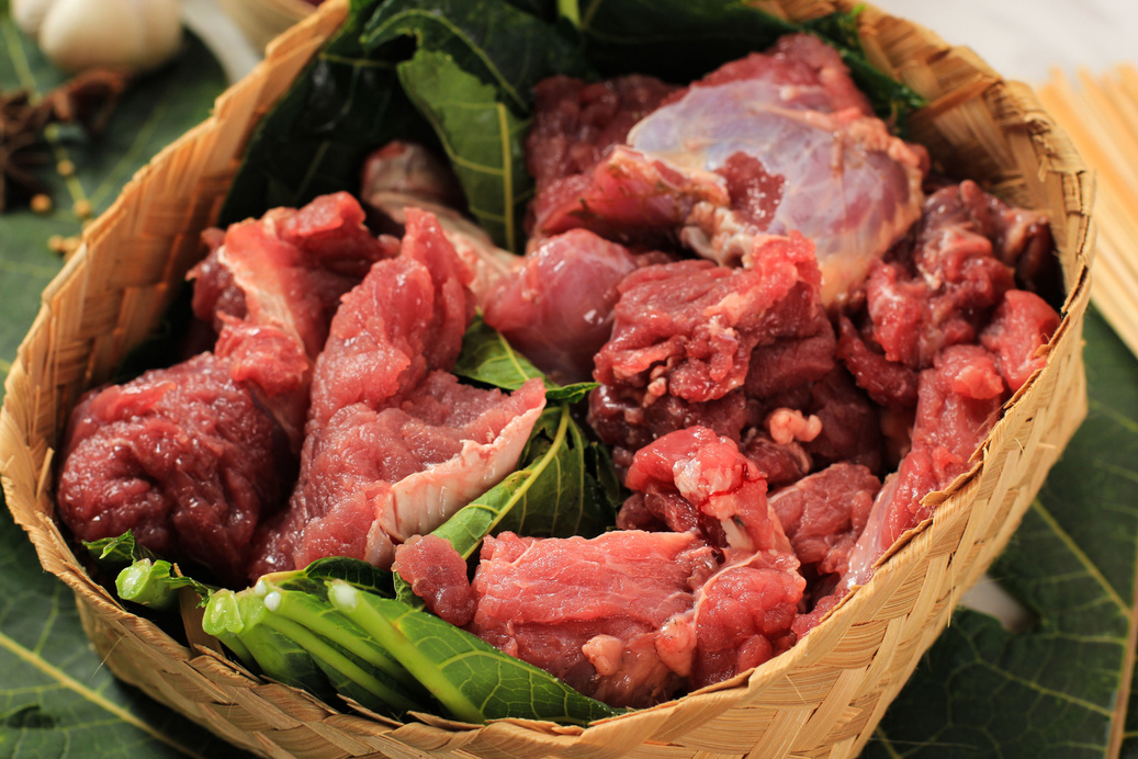 Indonesian Muslims,Prepare Halal Slaughtering (Daging Kurban) during Eid Al-Adha Al Mubarak, the Feast of Sacrifice or Qurban. Concept Go Green Daging Qurban.