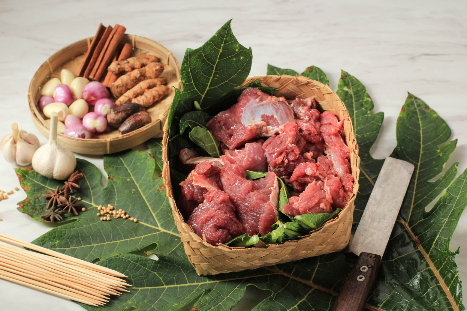 Meat on Bamboo Wooven Box or Besek, with Papaya Leaf Making Beef